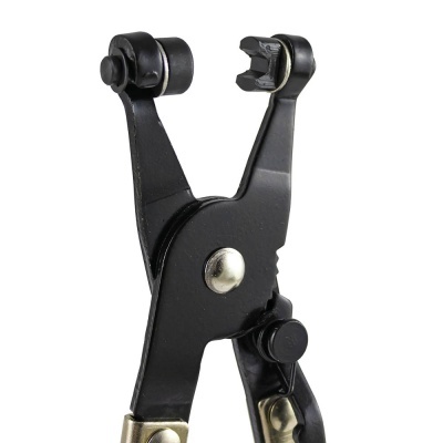 Alicate metálico preto com detalhes dourados