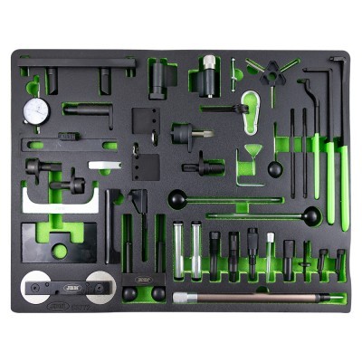 Conjunto de ferramentas de precisão organizadas numa base preta e verde.