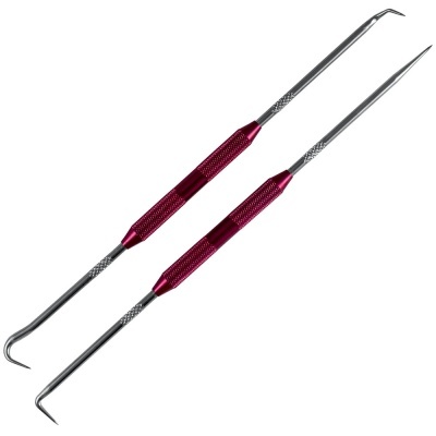 Duas ferramentas dentárias de metal com pega vermelha