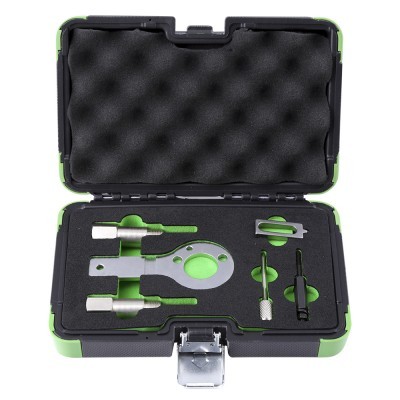 Estojo preto e verde com cinco ferramentas metálicas organizadas em espuma