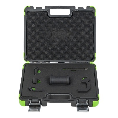 Estojo de ferramentas preto com cantos verdes aberto, contendo peças em espuma preta