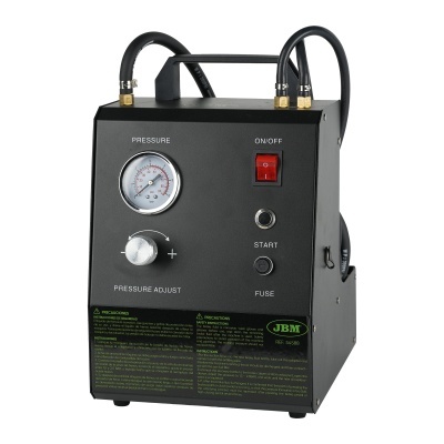 Equipamento industrial preto com medidor de pressão e botões