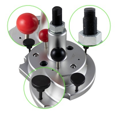 Ferramenta metálica circular com parafusos e botões em preto e vermelho