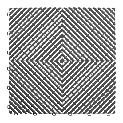 Tapete modular cinzento escuro com padrão geométrico e bordas de encaixe.