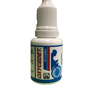 Frasco branco com etiqueta OXYCEDET e imagem de cadeira de rodas