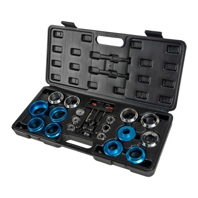 Conjunto de ferramentas com anéis azuis e prateados numa caixa preta aberta.