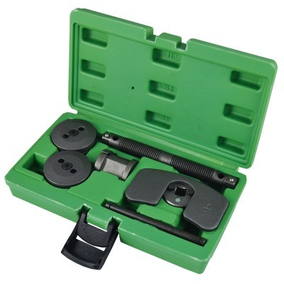 Conjunto de ferramentas num estojo verde com diferentes formas de metal negro