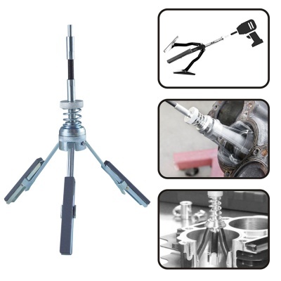 Ferramenta metálica com três braços extensíveis e pontas pretas para extração mecânica