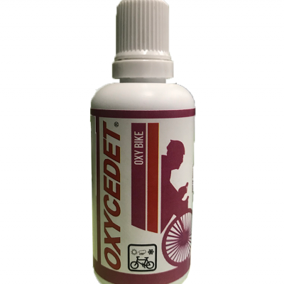 Frasco branco com etiqueta OXYCEDET OXY BIKE e imagem de bicicleta