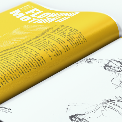 Revista aberta com página amarela e texto e desenho à tinta preta