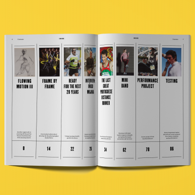 Revista aberta com colunas de texto e imagens sobre fundo amarelo