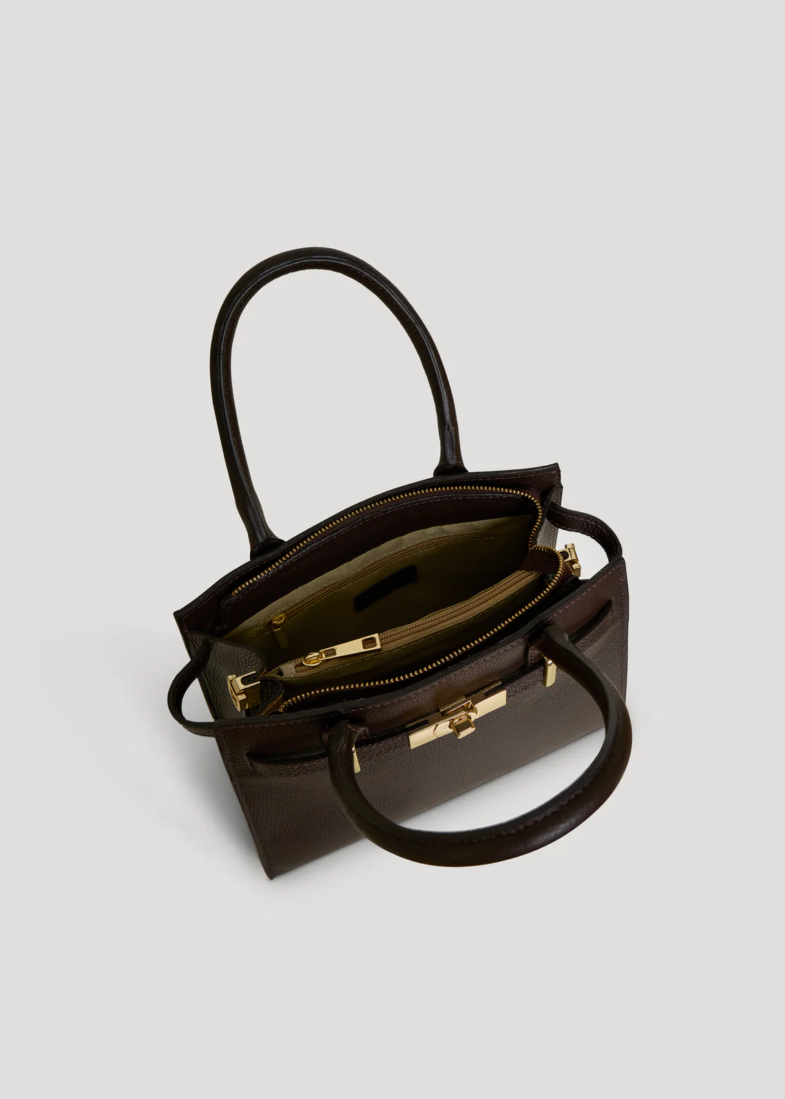 MALA EM PELE ITALIANA PORTOFINO CASTANHO | TUSCAN Mala de mão castanha escura com fecho dourado e interior forrado bege