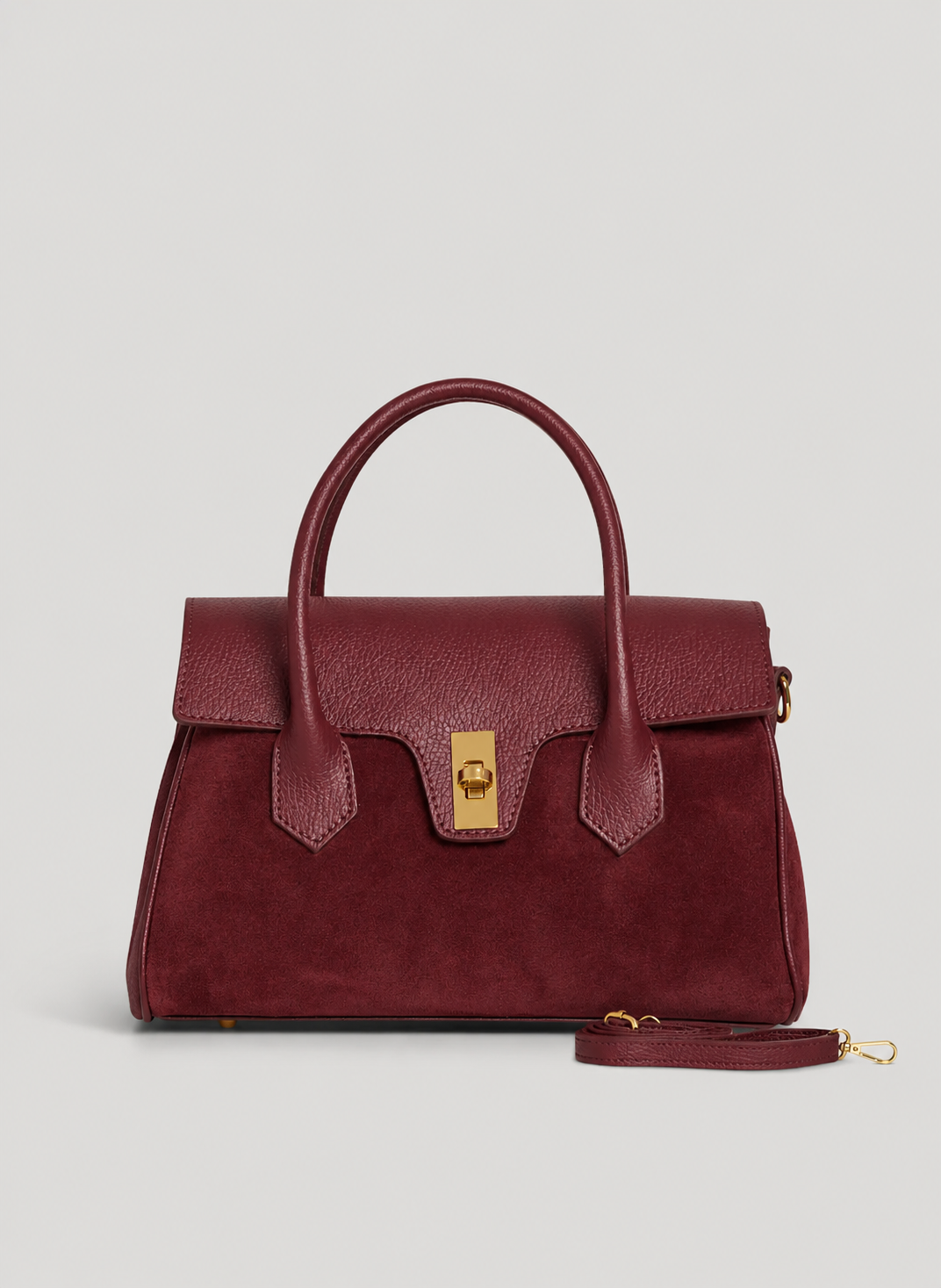 MALA EM PELE ITALIANA VOLTERRA BURGUNDY | TUSCAN Mala de mão bordô em camurça e pele com fecho dourado, alça destacável.