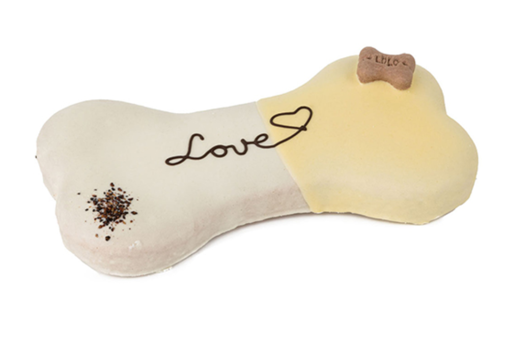 Brinquedo para cão em forma de osso com cor branca e amarela e texto Love
