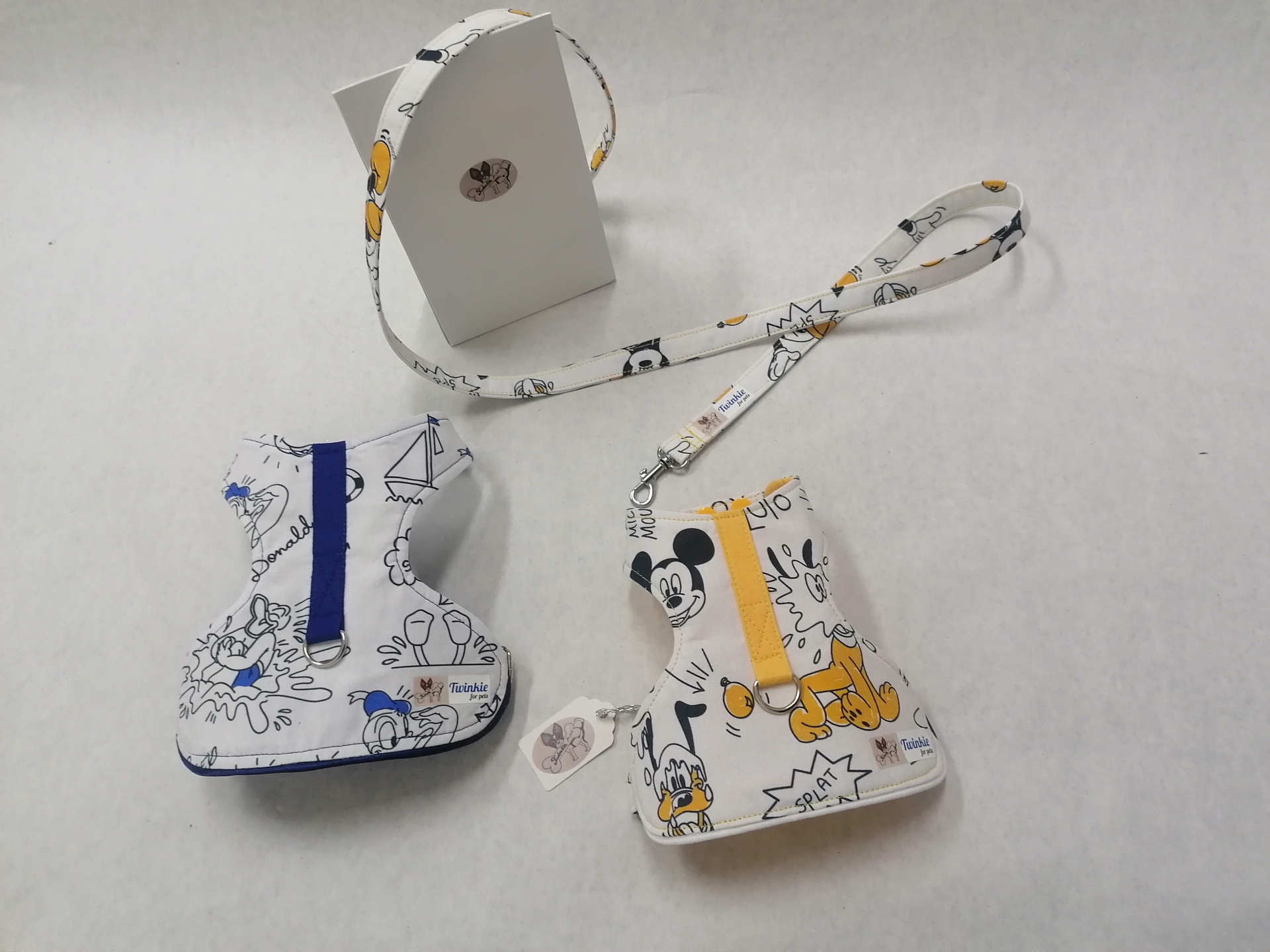 Suportes para garrafas de tecido com desenhos Disney e alças de transporte