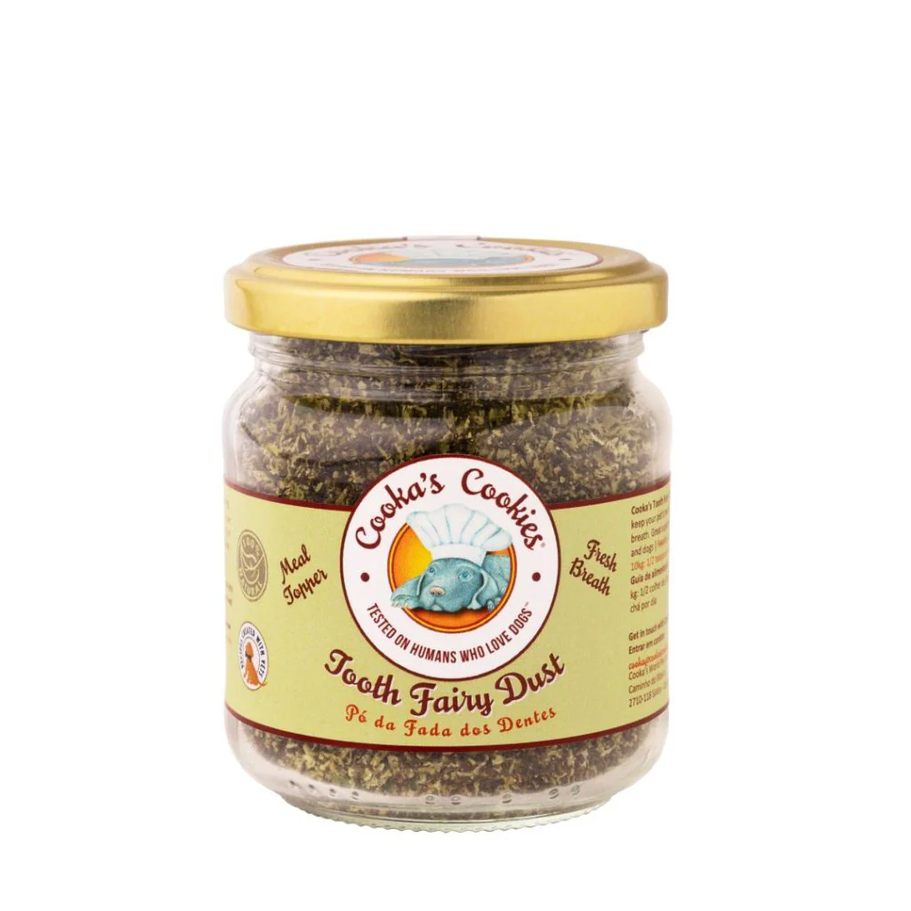 Frasco de vidro com tampa dourada contendo pó verde e etiqueta Cookas Cookies Tooth Fairy Dust
