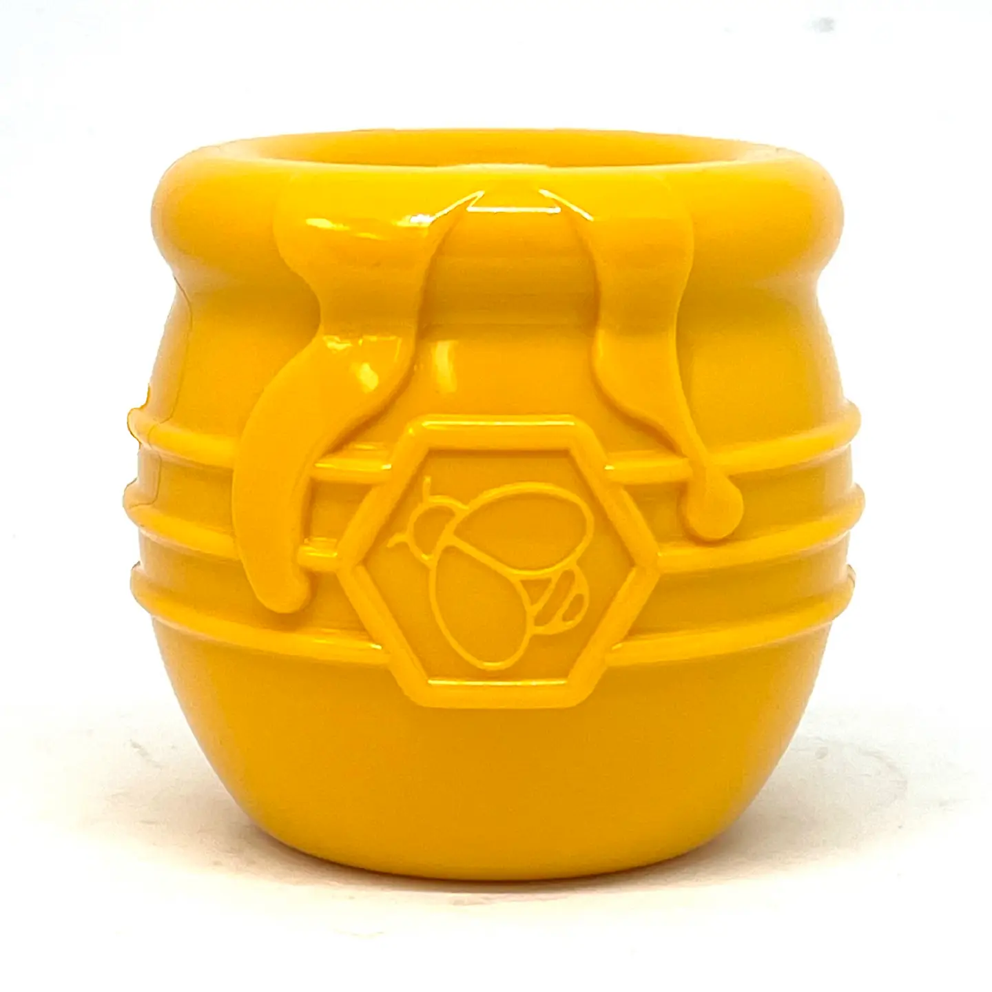 Pote amarelo de plástico com relevo de abelha e favo de mel