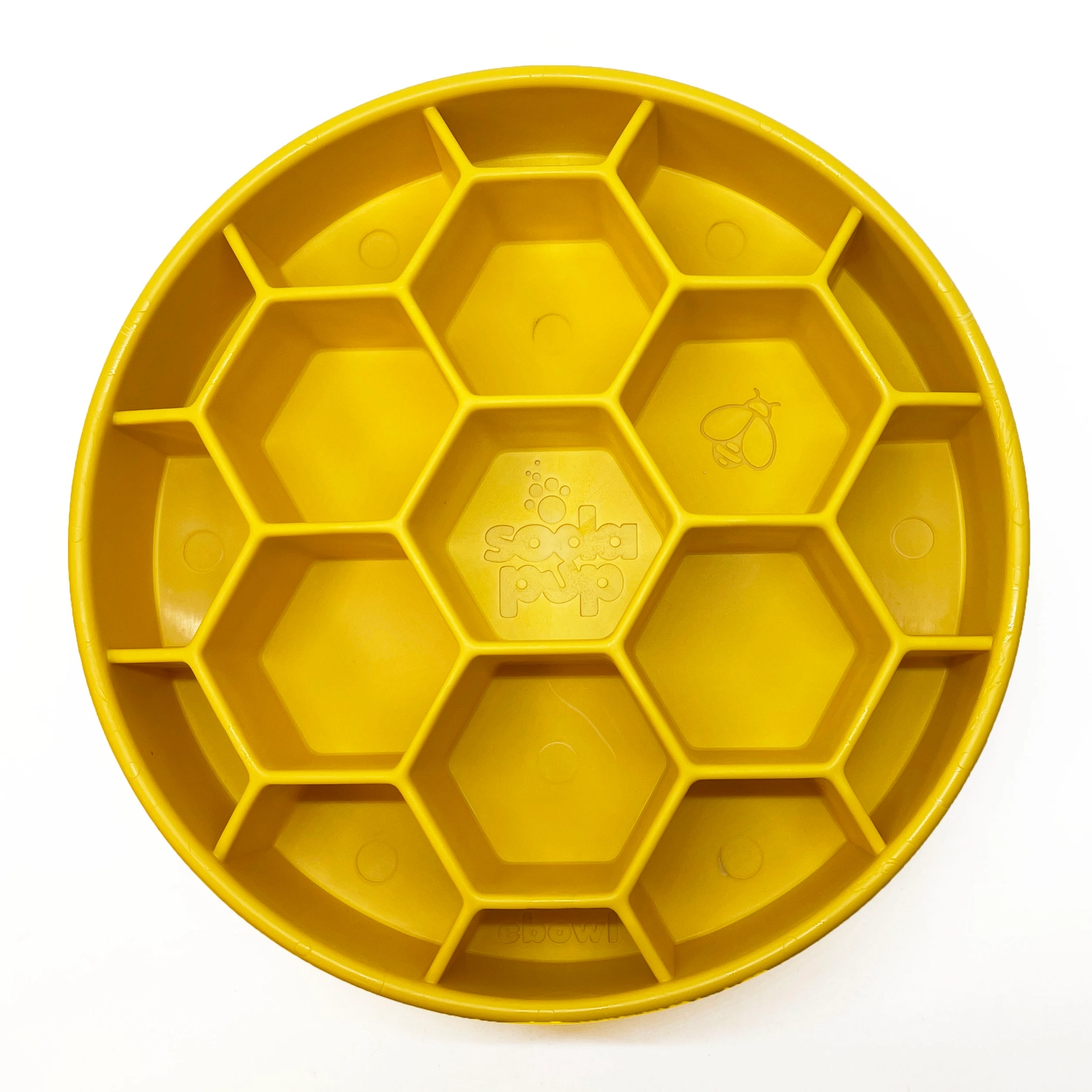 Prato amarelo redondo com divisórias hexagonais e desenho de abelha