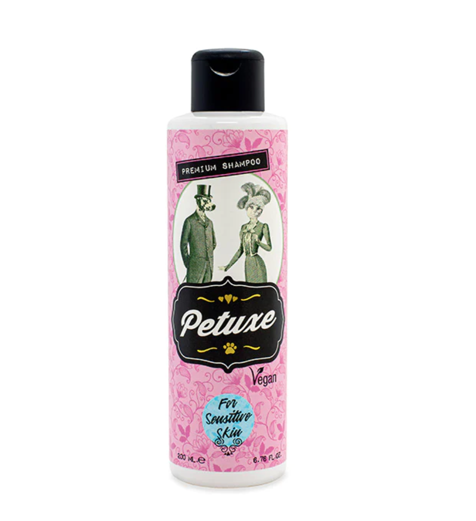 Frasco de shampoo Petuxe rosa com tampa preta e ilustração vintage