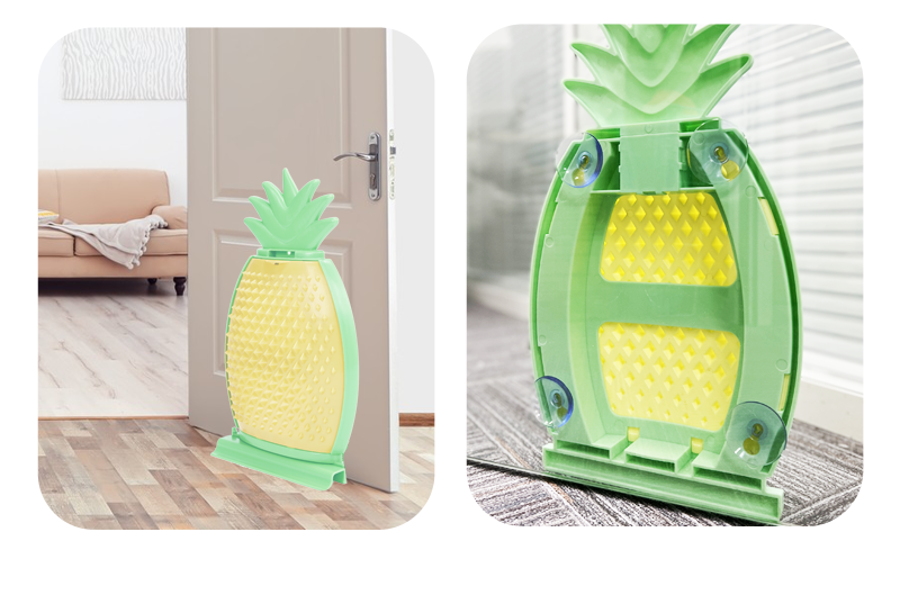 Porta em forma de ananás verde e amarelo com ventosas, instalada numa porta interior