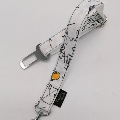 Correia branca com padrão preto e amarelo, gancho metálico e etiqueta preta 'La Festa'