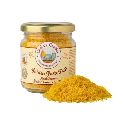 Frasco de vidro com tampa dourada e pó amarelo dourado ao lado