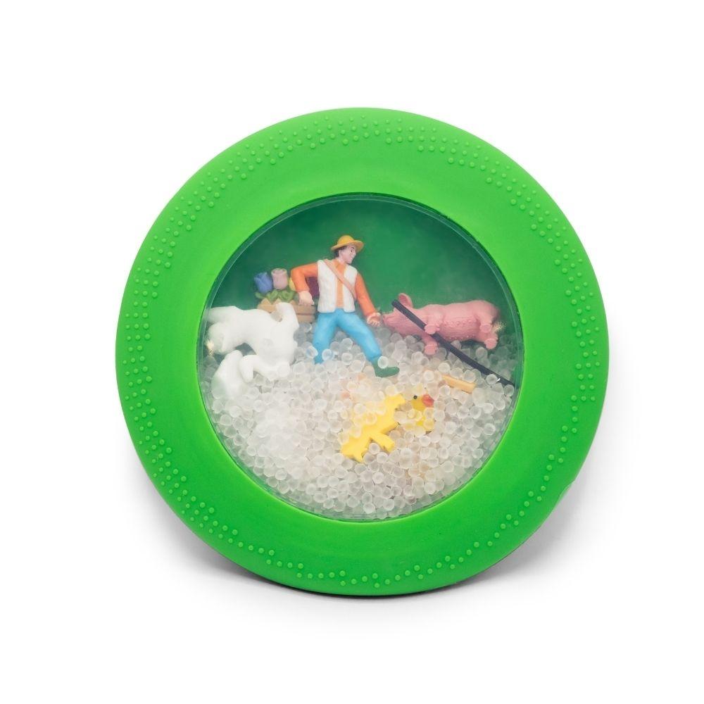 Brinquedo sensorial redondo com figuras de fazenda dentro