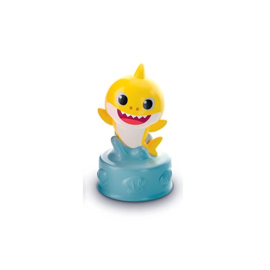 Figura de tubarão amarelo com base azul