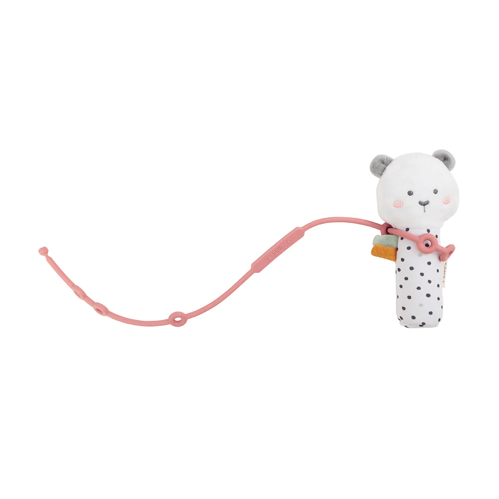 Chocalho de bebé branco com pontos pretos e cordão rosa