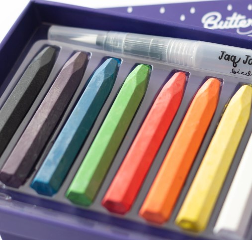 Conjunto de pastilhas de cera colorida com pincel em caixa roxa