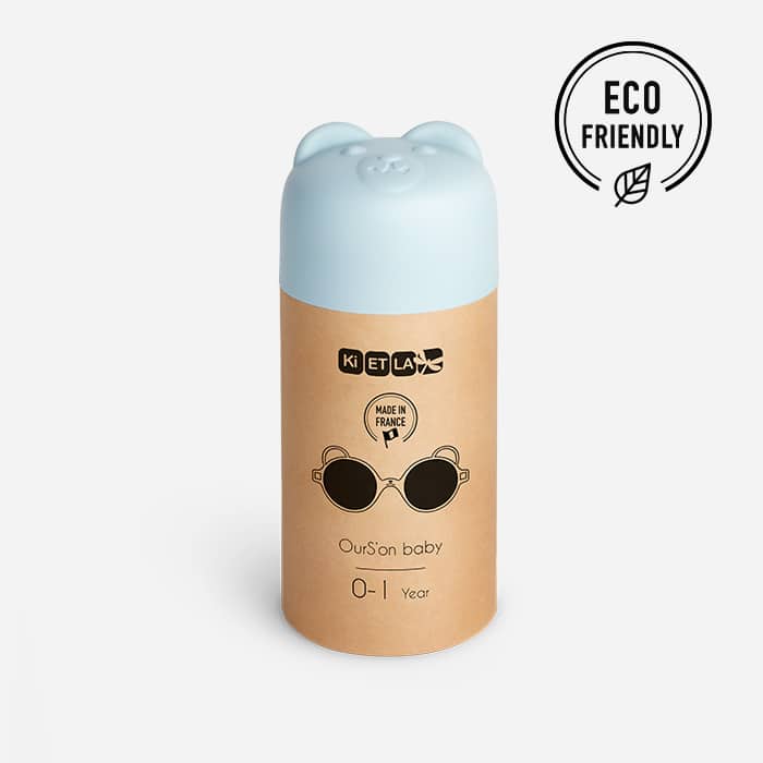 Recipiente cilíndrico com tampa azul em forma de urso e corpo castanho com texto e ícone ecológico