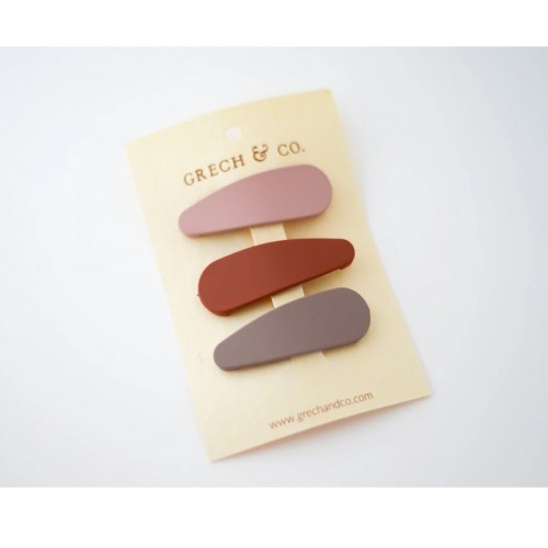 Três presilhas de cabelo em cores neutras em cartolina com marca Grech & Co.