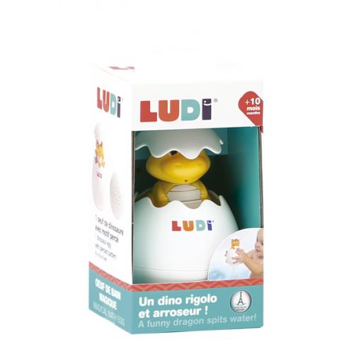 Brinquedo dinossauro amarelo dentro de ovo branco na embalagem LUDI
