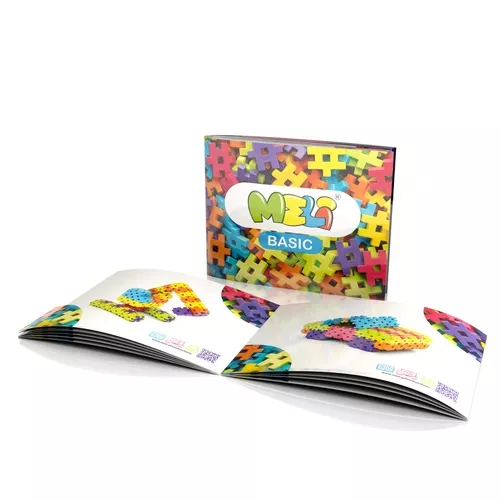 Peças de encaixe coloridas com caixa MEL BASIC e manuais abertos