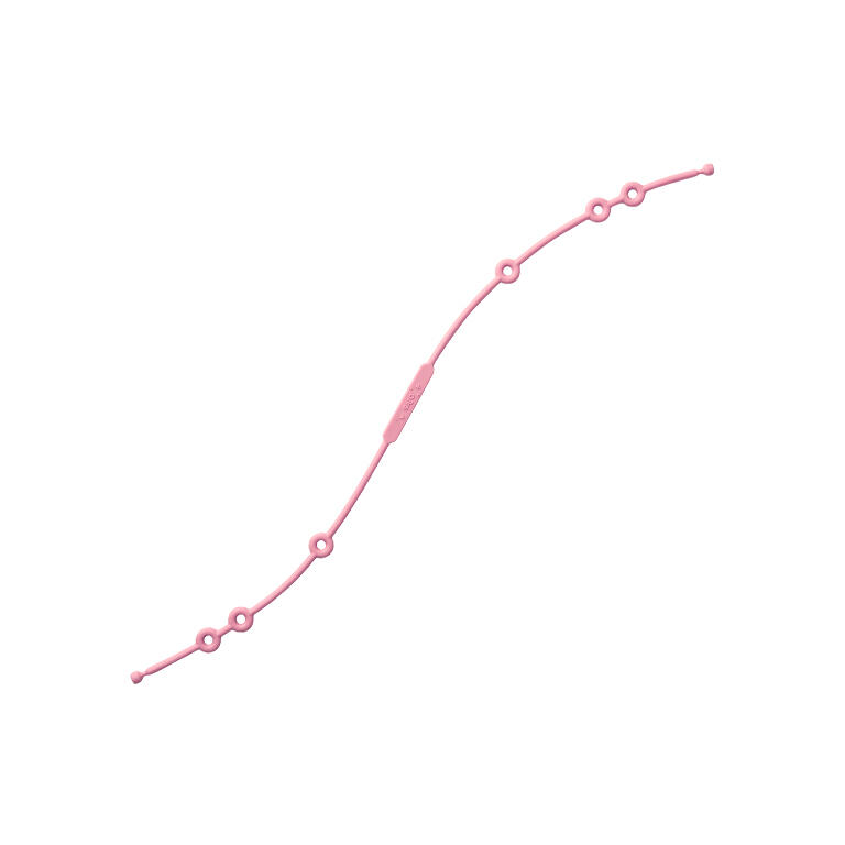 Produto cor-de-rosa em silicone com orifícios circulares sobre fundo branco