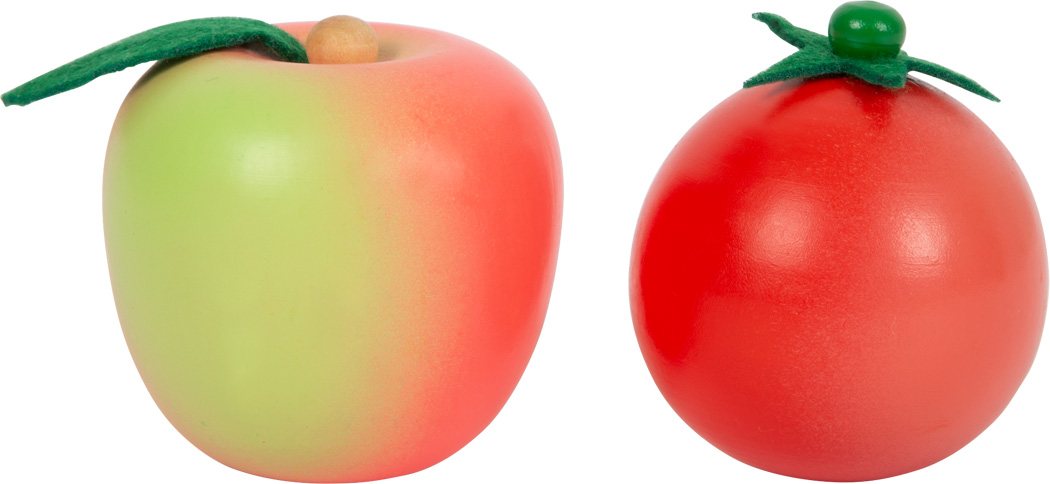 Brinquedos de plástico de uma maçã verde e vermelha e um tomate vermelho sobre fundo branco