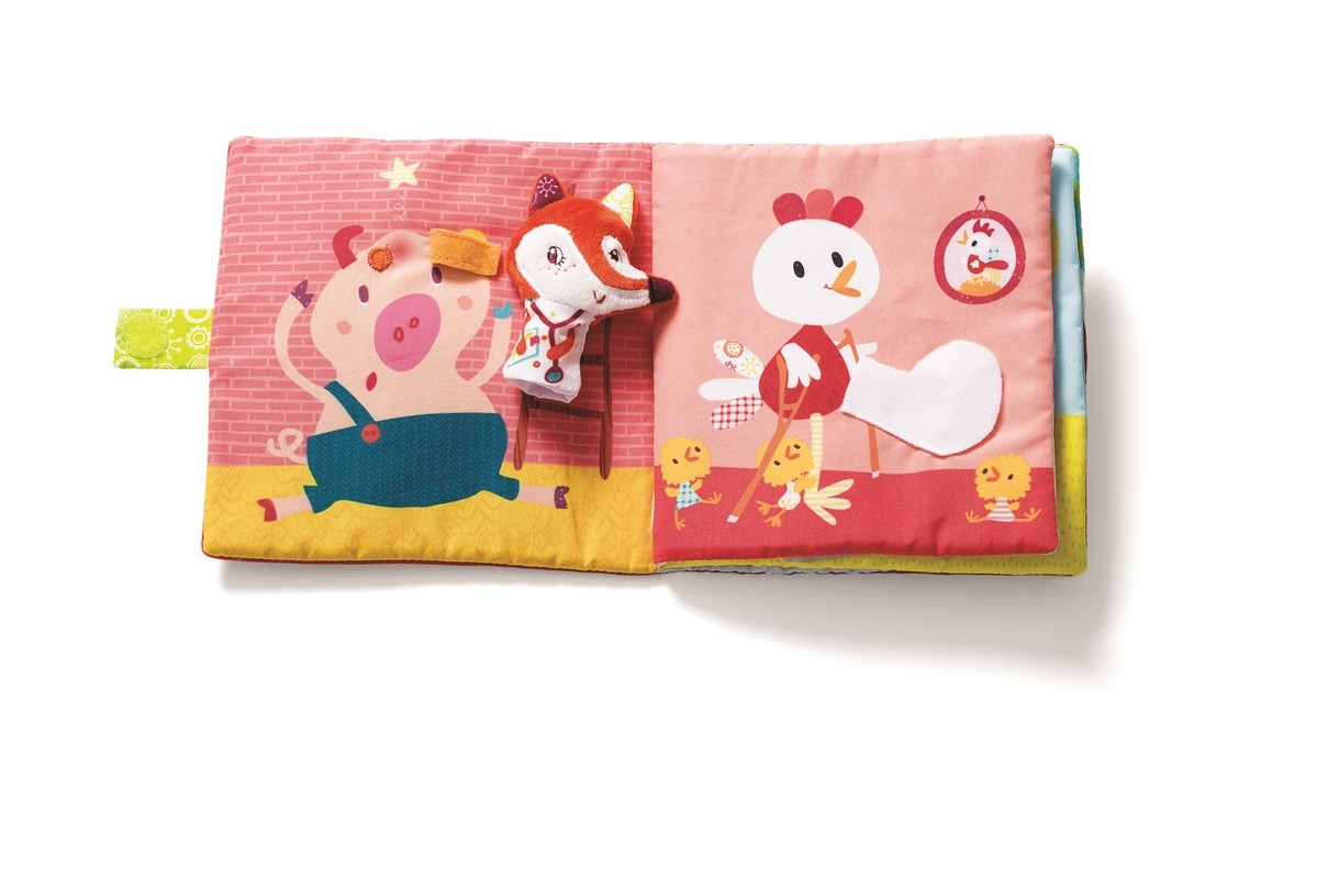 Livro de tecido colorido para bebés com personagens de animais e uma raposa em peluche.