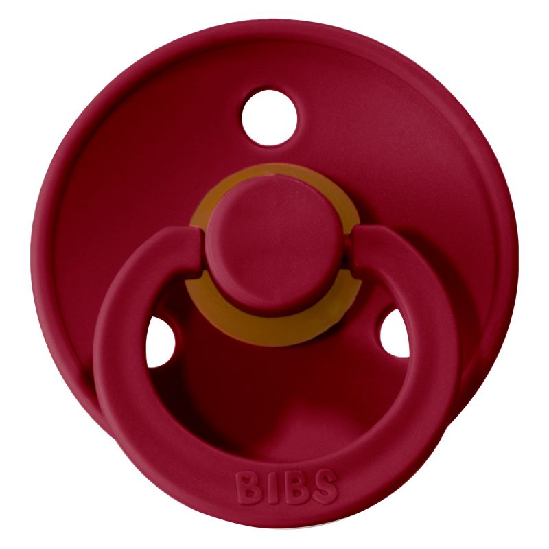 Chupeta de bebé vermelha com detalhe castanho e palavra BIBS