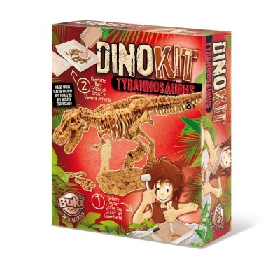Embalagem de kit Dinokit Tyrannosaurus com fóssil para montar e ilustração de criança escavando.
