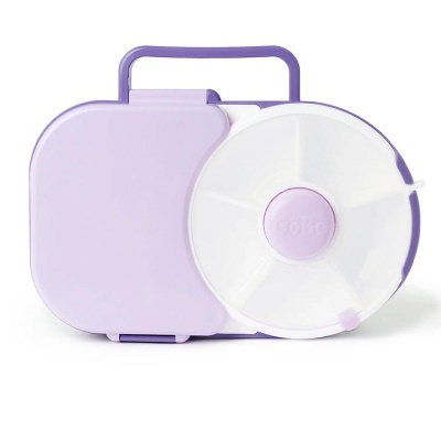 Estojo plástico lilás com tampa branca redonda e compartimentos