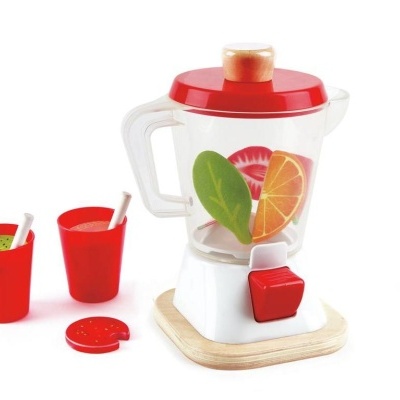 Liquidificador de brinquedo branco e vermelho com copos e decoração de frutas