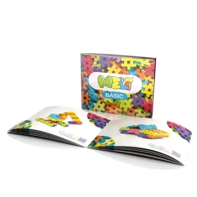 Peças de encaixe coloridas com caixa MEL BASIC e manuais abertos