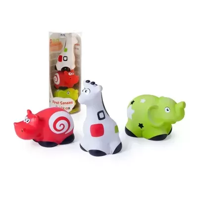 Três brinquedos de borracha coloridos em forma de animais com olhos grandes