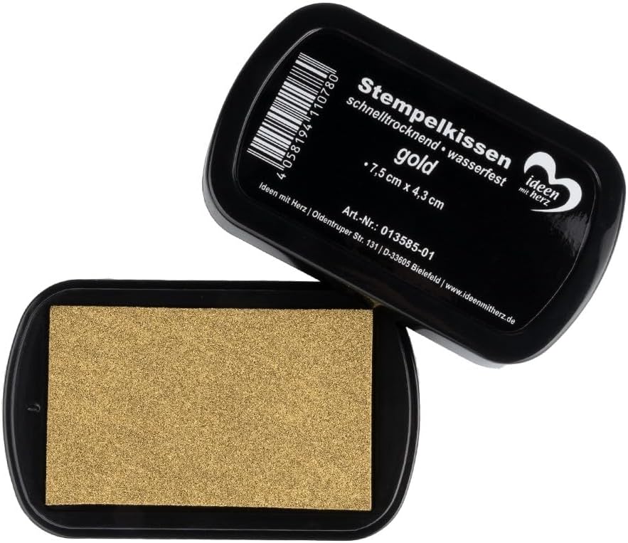 Tinteiro para carimbo dourado em caixa preta com texto em alemão na tampa