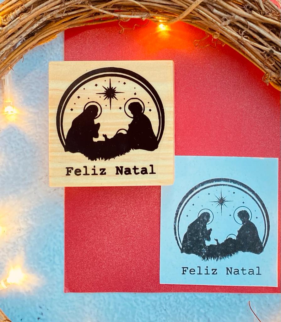 Carimbos de Natal com figura da Natividade e texto Feliz Natal