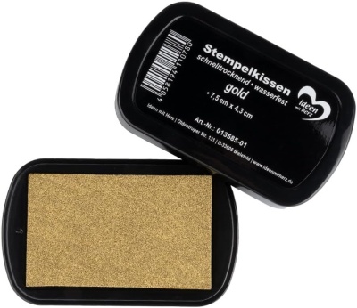 Tinteiro para carimbo dourado em caixa preta com texto em alemão na tampa