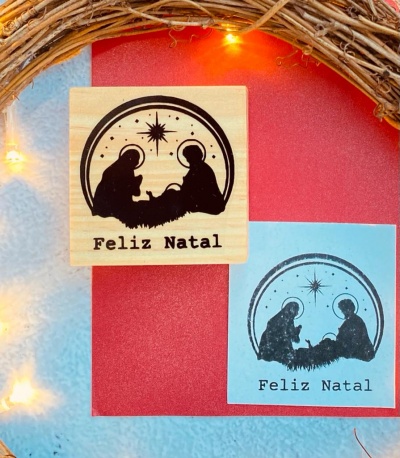 Carimbos de Natal com figura da Natividade e texto Feliz Natal