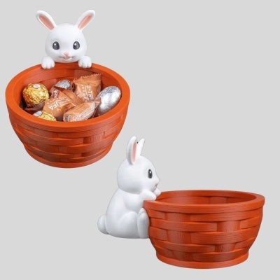 Cesta laranja com coelho branco e doces embalados