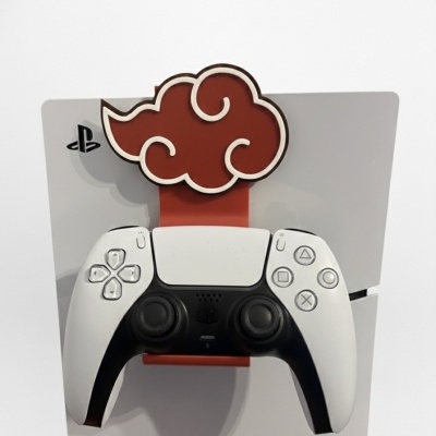 Comando PS5 em suporte vermelho em forma de nuvem com consola PS5 branca