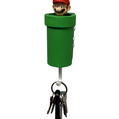 Porta-chaves verde forma cano e cabeça do Mario com boné vermelho e molho de chaves